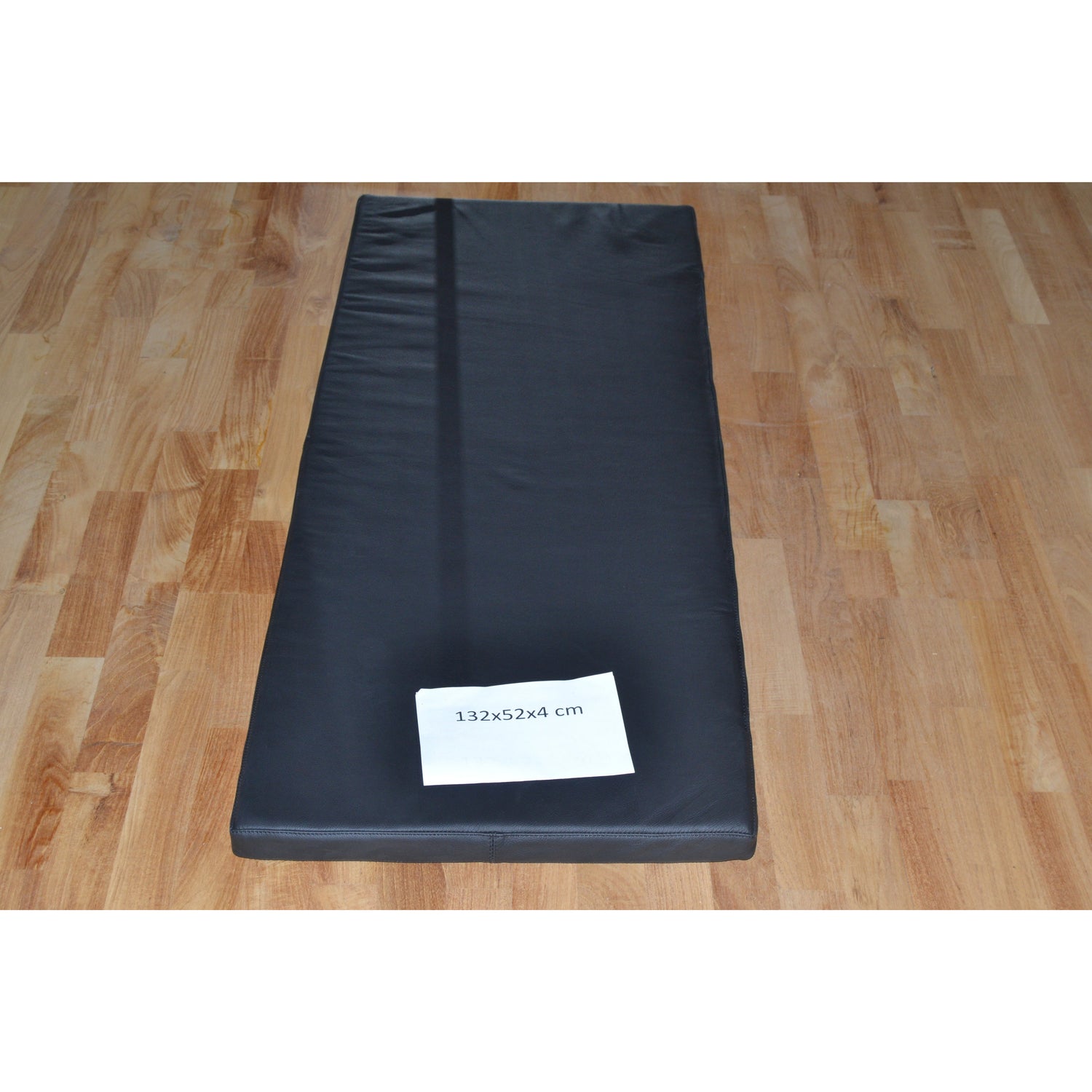 Svart skinnpute 132x52x4 cm